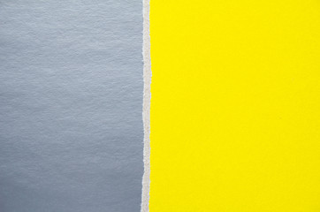 Silver grey and yellow torn cardboard paper texture background. Can be used for text.