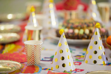 Festive paper caps on the table.
