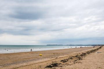 Fototapeta na wymiar Beach with dark clouds and incoming rain storm