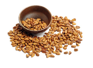 Pine nuts on white background