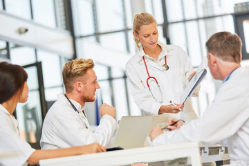 Doctors in a workshop discuss a project