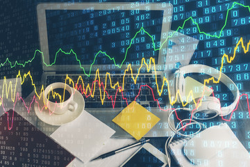 Double exposure of forex chart and work space with computer. Concept of international online trading.
