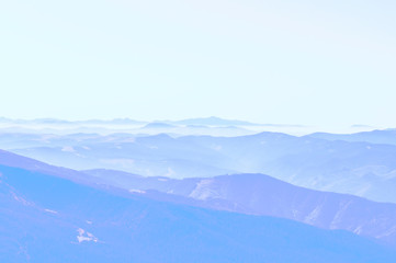 Fototapeta premium Mountain clean landscape for the background of the website landing page or booklet. Rocks and hills far in the horizon. Colored sky.