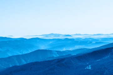 Mountain clean landscape for the background of the website landing page or booklet. Rocks and hills far in the horizon. Colored sky.