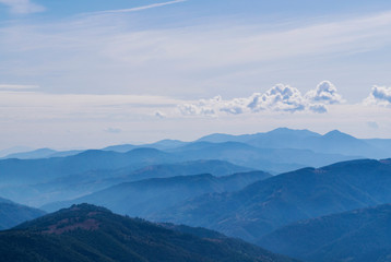Mountain clean landscape for the background of the website landing page or booklet. Rocks and hills far in the horizon. Colored sky.