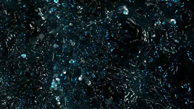 Water splashing on black background, super slow motion. Filmed on high speed cinema camera, 1000 fps.