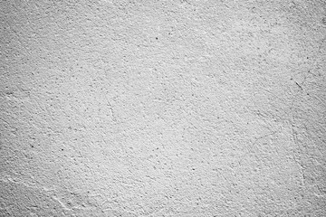 Texture of a concrete wall with cracks and scratches which can be used as a background