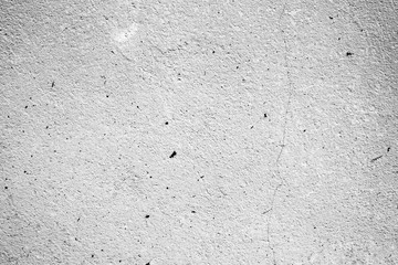 Texture of a concrete wall with cracks and scratches which can be used as a background