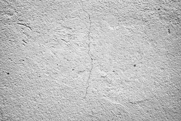 Texture of a concrete wall with cracks and scratches which can be used as a background