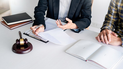 lawyer having meeting and consoling solution to his clients provide legal advice and trust commitment strain serious for problem, justice and attorney concept.
