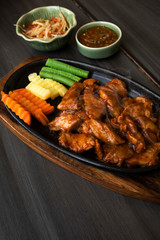 Roast pork with sauce in a hot pan of Thailand