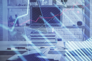 Financial chart drawing and table with computer on background. Double exposure. Concept of international markets.