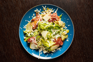 tasty salad with parma and cheese