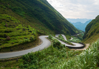 Ha Giang karst geopark mountain landscape in North Vietnam. Winding road in stunning scenery. Ha...