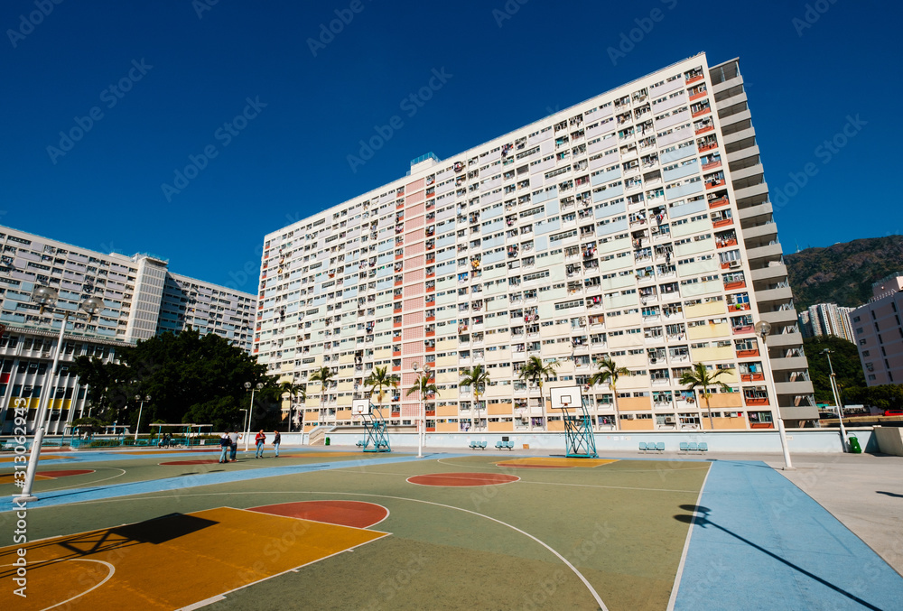 Sticker basketball court and rainbow colored building facade in HongKong