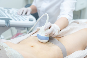 Gynecologist doing ultrasound scan in modern clinic