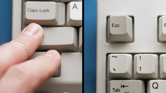 Male finger pushes CTRL + SHIFT + ESC button on white keyboard. Slow motion and macro view