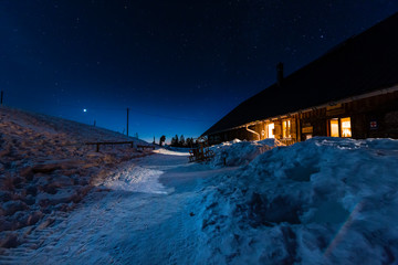 Germany, Bavaria, Allgaeu Alps, winter night scene with old mountain hut