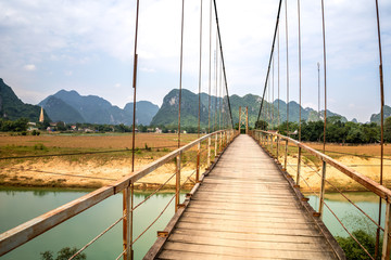 Rustic iron bridge in a rural part of Phong Nha  Vietnam 