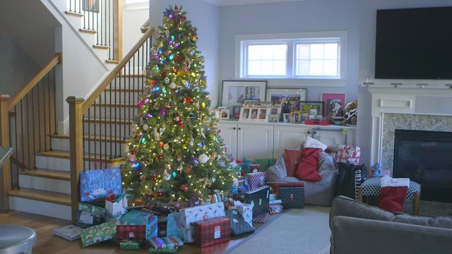 Christmas tree in living room with presents underneath