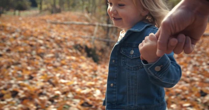 Happy Little Girl Running Holding Dads Hand with Dog in Autumn Season