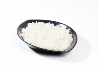 bowl of boiled rice on white background
