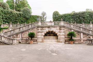 Ancient architecture of Italy. Old steps in the large garden of the European castle