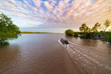 Boat tour in the Mekong River Delta region, Ben Tre, South Vietnam. Wooden boat on cruise in the...