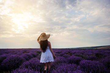 back view of a woman with hat in lavander field