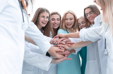 top view. a group of smiling doctors pointing at you.