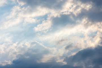 blue clouds on the sky in the rays of the sun in the fall. Landscape background texture, copy space