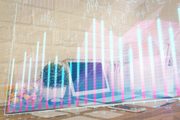 Financial chart drawing and table with computer on background. Multi exposure. Concept of international markets.
