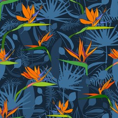 Seamless pattern with exotic flowers paradise Strelitzia and tropical leaves classic blue background. Vector tropical stock illustration.African plant flower. Design textile, wallpaper, wrapping paper