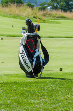 Golf bag with clubs in golf curse