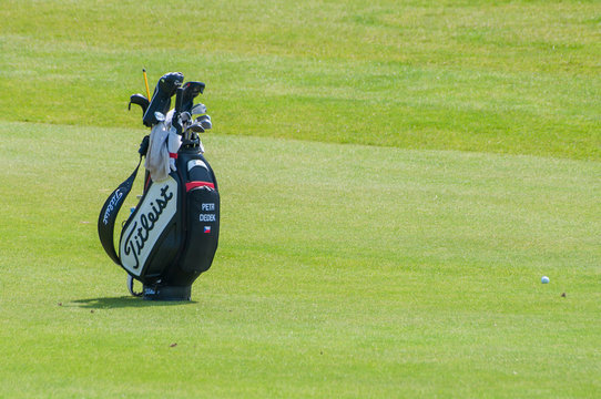 Golf bag with clubs in golf curse