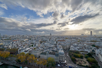 Fototapeta na wymiar Aerial panorama of cityscape with a beautiful architecture of the Paris and with a cloudy sky over France.