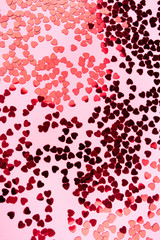Pink background with red hearts. Valentine's day concept. Top view.