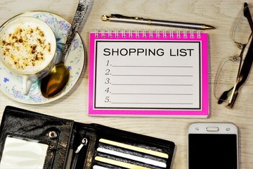 Naklejka premium Shopping list-plan to buy a gift in stores at a discount at competitive prices. Laptop for business strategy, glasses, pen for writing, smartphone for the Internet, purse with credit cards and money.