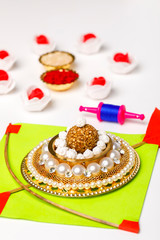 Indian festival makar sankranti concept, sesame seed ball or til ke laddo and tilgul with colorful paper kite