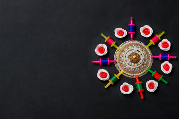 Obraz na płótnie Canvas Indian festival makar sankranti concept, Kite String with Sesame seed ball or til ke laddo