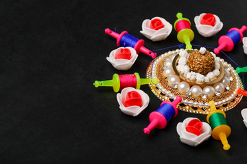 Indian festival makar sankranti concept, Kite String with Sesame seed ball or til ke laddo