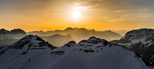 Sunrise in snowy mountains