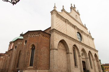 Fototapeta na wymiar Church of Santa Maria Annunciata Cathedral in Vicenza, Italy. Ornate Italian Gothic facade completed in 1467.