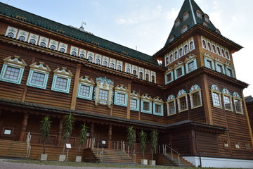 Fototapeta premium Wooden Palace Of Moscow Kolomenskoye - colorful Tourism landmark attractions in Russia - royal old palace with golden cyan brown green white colors made out of wood