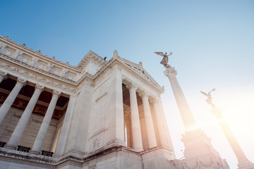 Columns of building on Venice Square in Rome Italy, blue sky