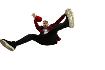 A second before falling. Caucasian young man falling down in moment with bright emotions and facial...