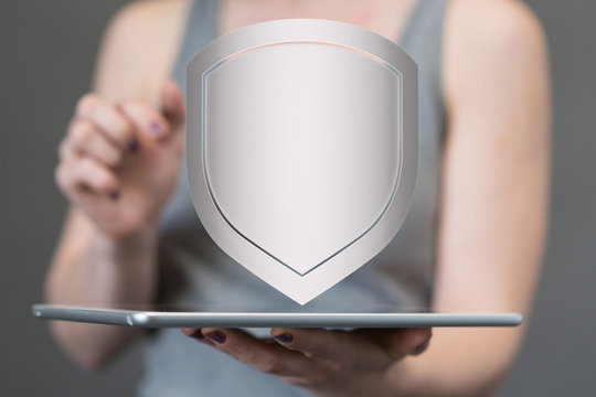 shield protection concept holding in hand