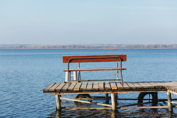 Empty bench by the river.