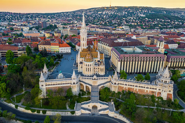 Budapest, Hungary - Aerial drone view of the famous Fisherman's Bastion (Halaszbastya) and Matthias Church on a summer morning - obrazy, fototapety, plakaty