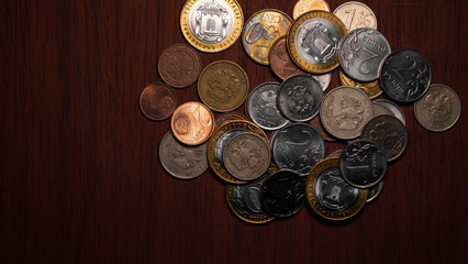 Coins closeup. Rubles and Euros.Coins of different countries. Cash. Coins in denominations of 10 rubles,2 rub, 1rub,50euro cents,2cents,1cent.The concept of investment, currency exchange and business.